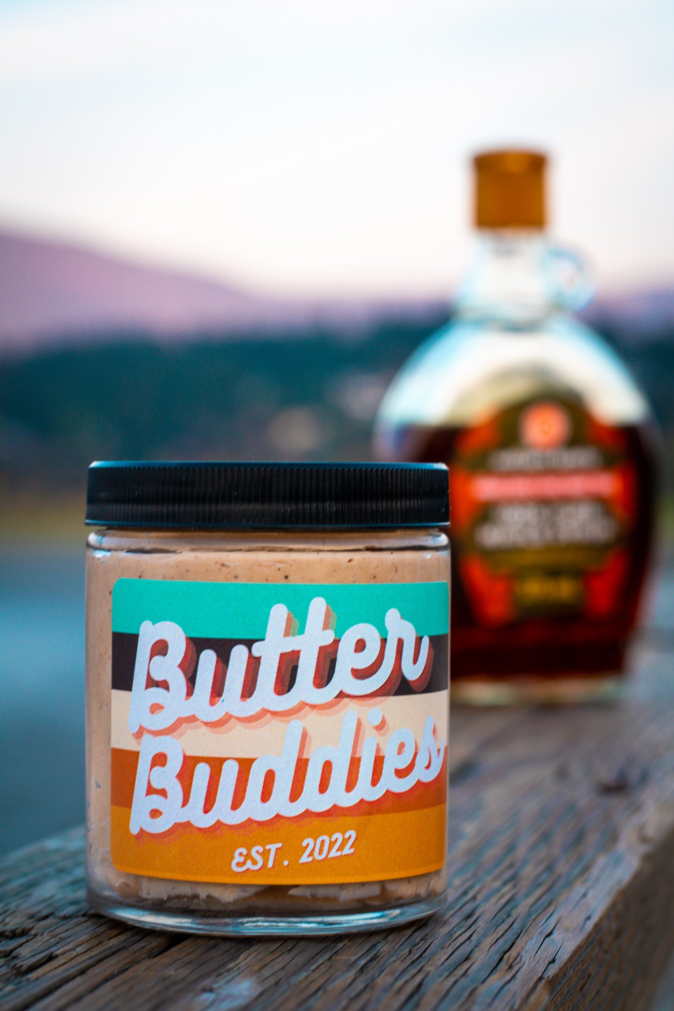 Maple Cinnamon Butter, with maple syrup in the background.round.